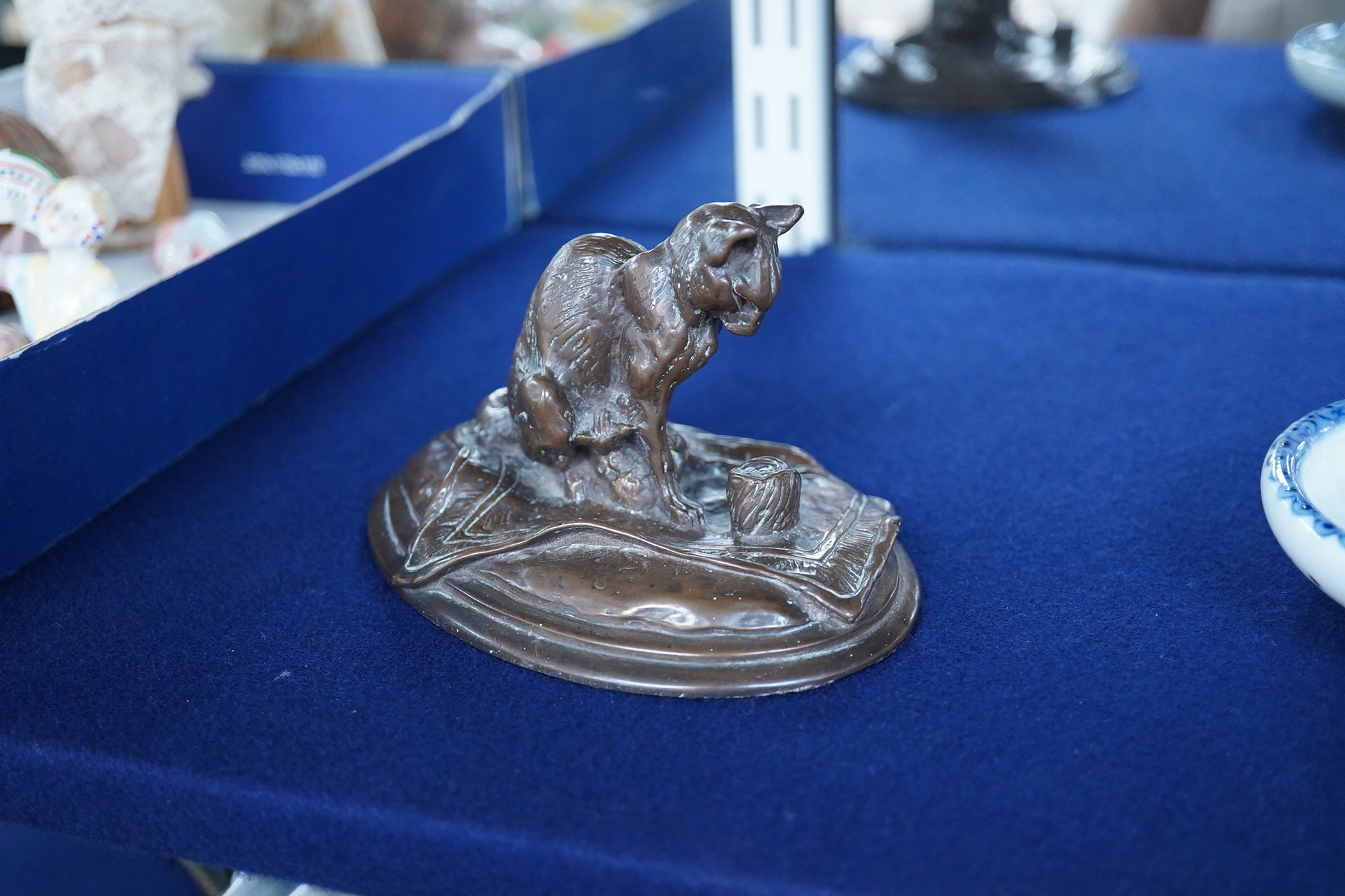 After Emmanuel Fremiet (1824-1910), a study of a seated cat, signed, 13cm wide